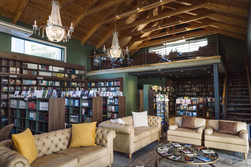 The Book Room at the Reformed Church of Hout Bay — a double-height library with timber trusses and full-height bookshelves